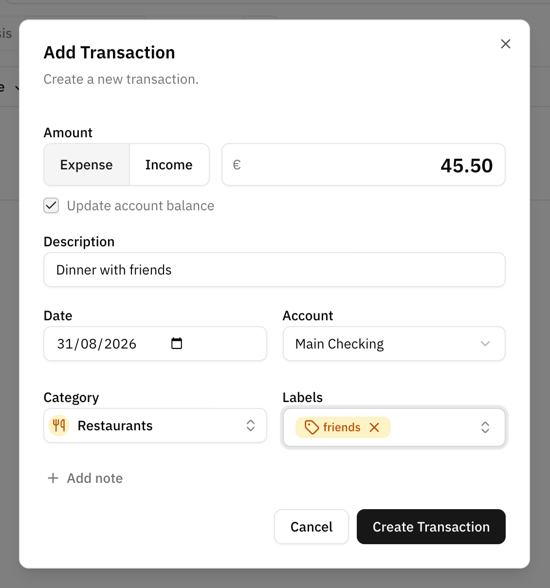 The create transaction dialog, with the expense and income toggle next to the amount at the top, the description, date and account fields below, and the category and labels pickers under them